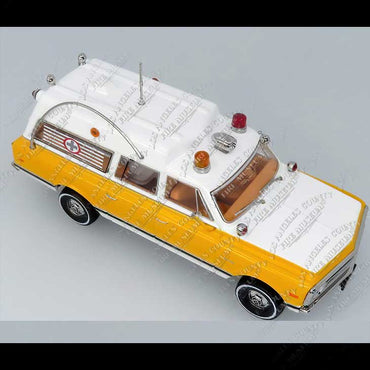 Model of a yellow and white ambulance on a gray background