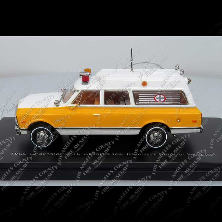 Model of a 1969 Chevrolet Ambulance on a display stand with visible branding.