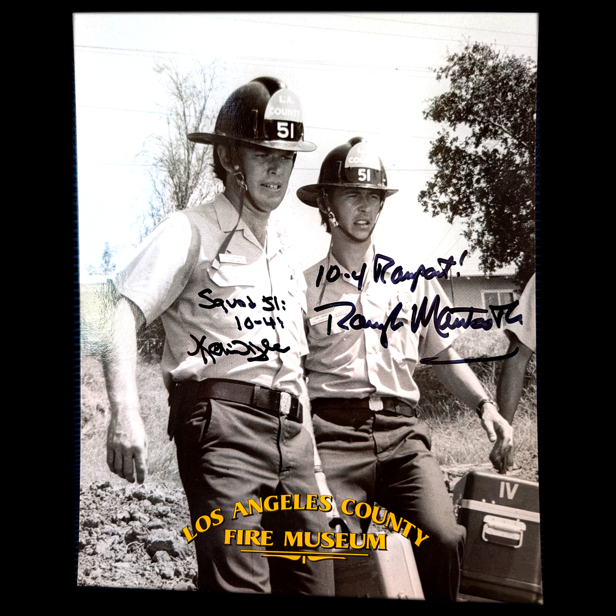 Two firefighters, Johnny Gage and Roy DeSoto, in uniform with signatures and text, featuring the Los Angeles County Fire Museum.
