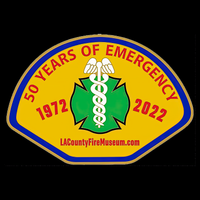Emblem celebrating 50 years of emergency services from 1972 to 2022, featuring a medical symbol on a yellow background.